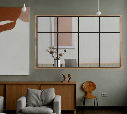 Intérieur moderne avec un mur décoré, un bureau et des meubles en acier de l'atelier Héphaïstos.